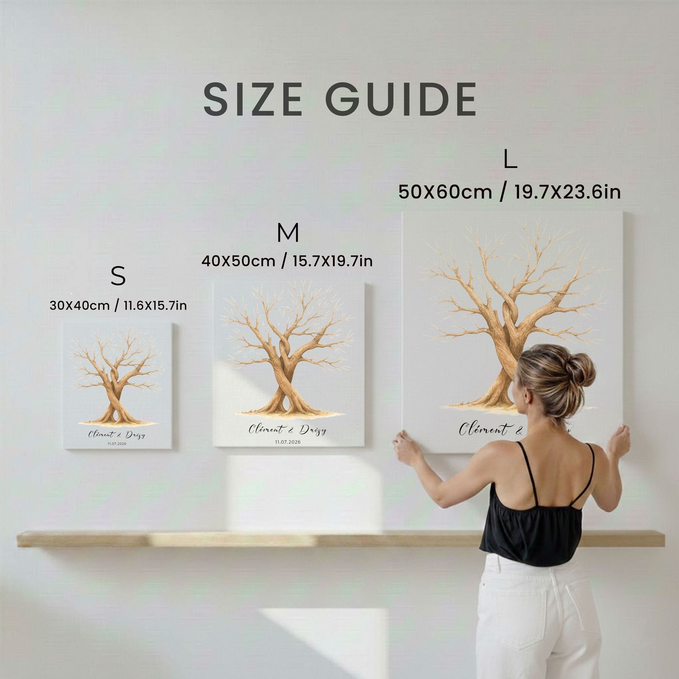 Size guide showing S 30×40 cm, M 40×50 cm and L 50×60 cm hung on a wall next to a person